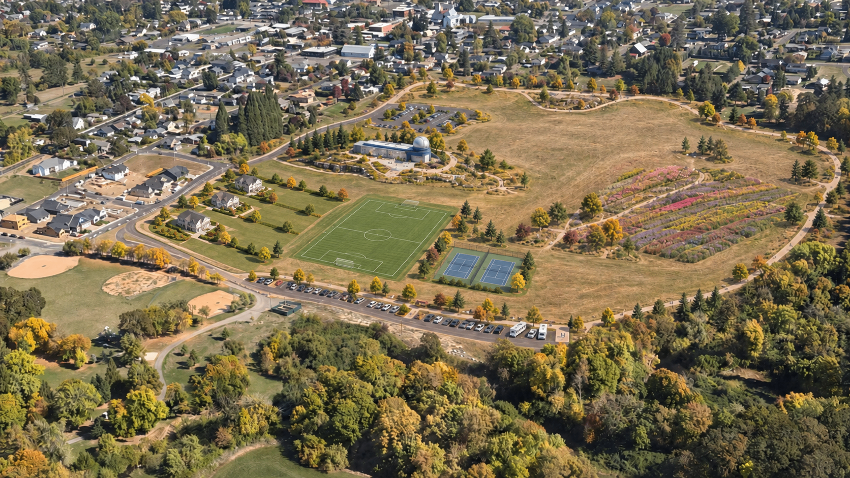 Conceptual aerial of the proposed Carlton park with the science center, homes, trails, flower field and parking